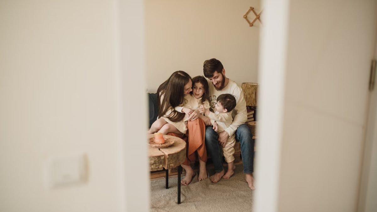 A loving family enjoying a warm, intimate moment together indoors.